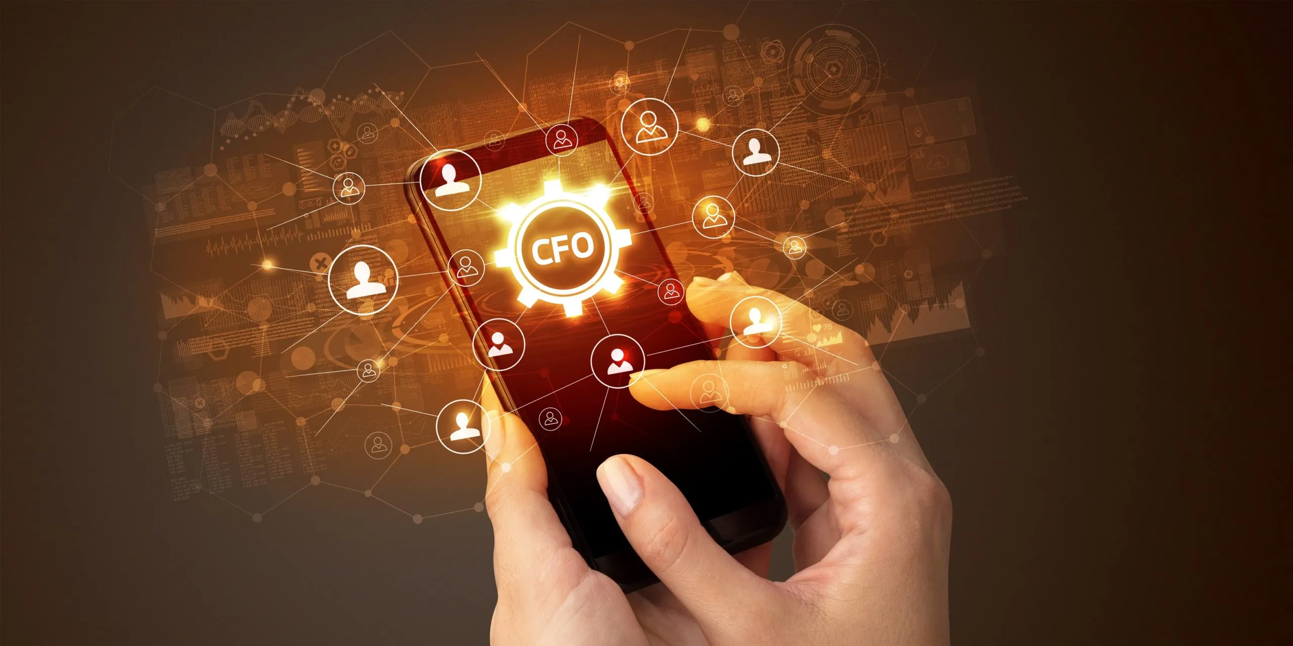 A hand holding a smartphone with a glowing CFO icon and connected finance icons