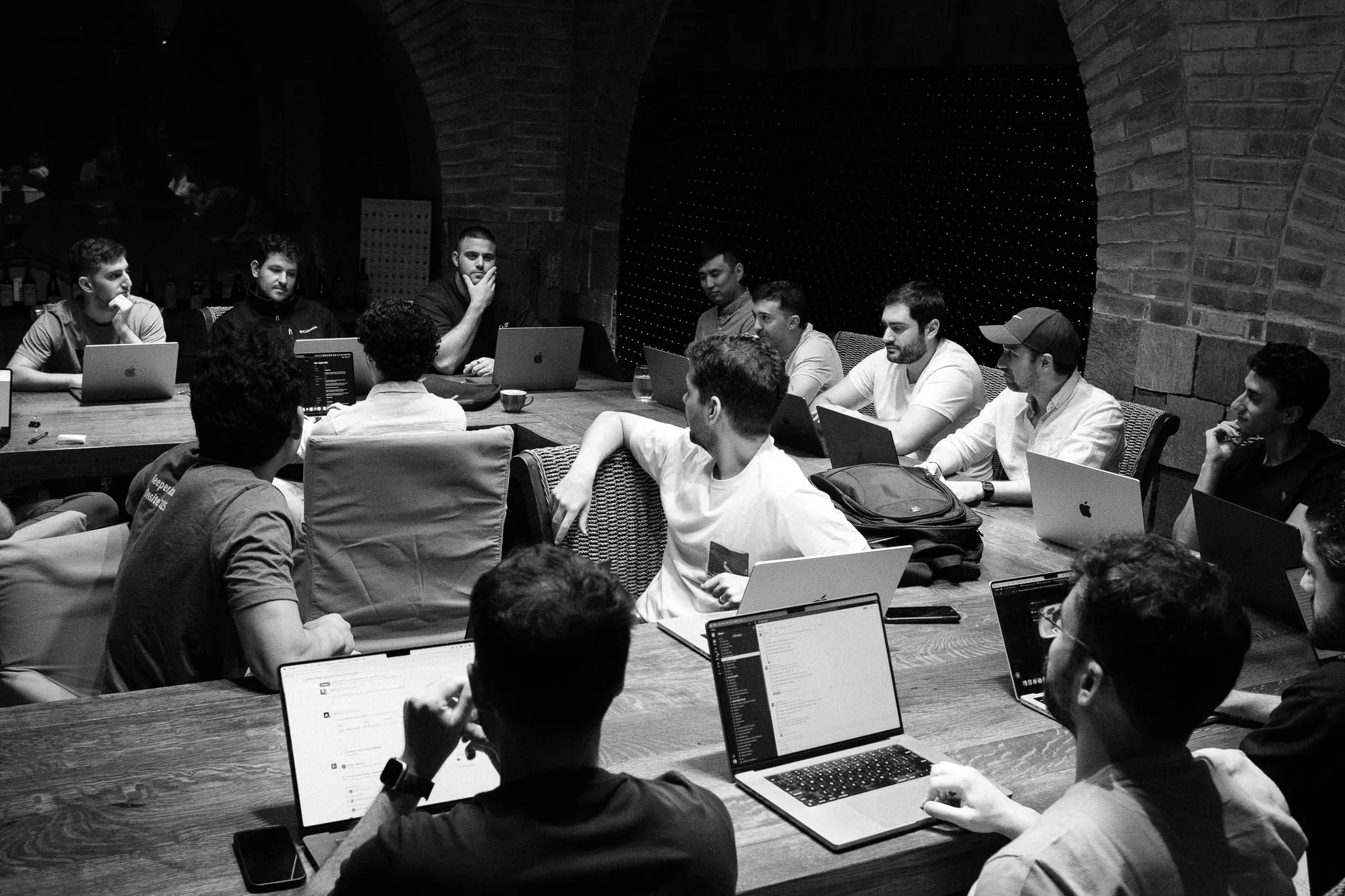 The Double team working on laptops around long tables