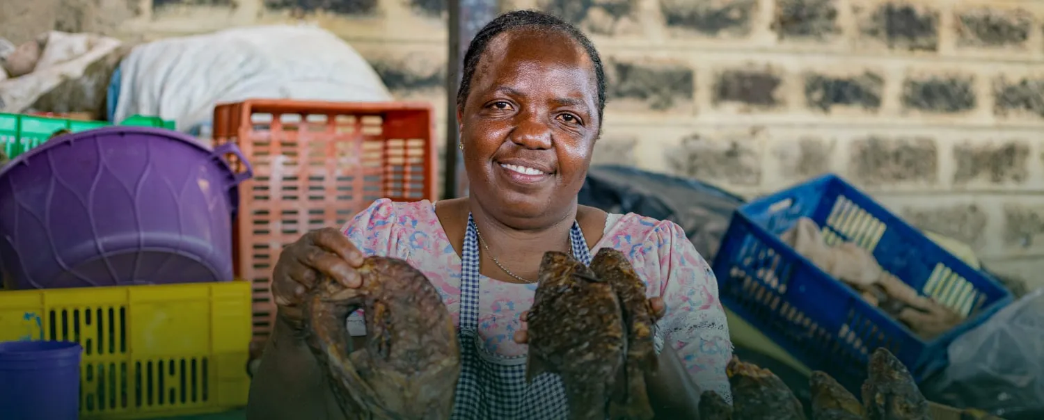 Judy, a fish trader in Gikomba, Nairobi, at her stall